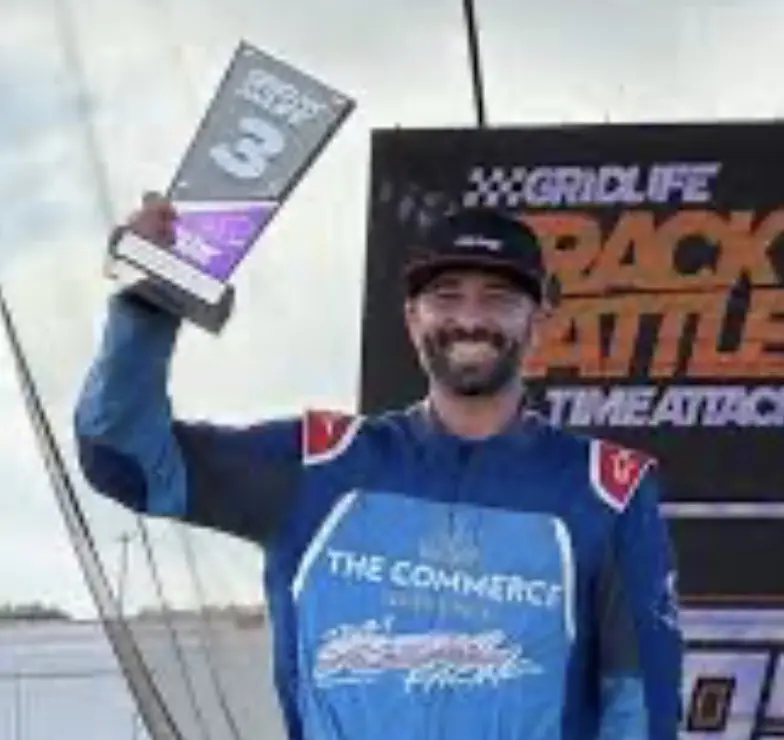 Anthony Scafuto holding a GRIDLIFE podium trophy